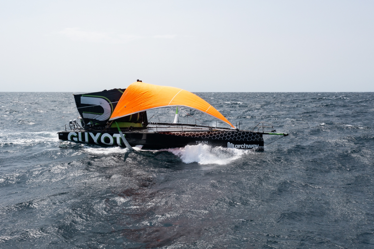 May, 2023, TOR, The Ocean Race, onboard, Leg 4, GUYOT environnement - Team Europe, 2022-23, Day 18, jury-rig, storm jib, mainsail, dismasted, damage, drone, aerial, ocean, Nature, horizon, bow, bowsprit, foil, mast